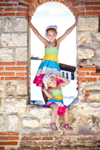Beautiful little girls in ancient ruins of the Nesebar Stock photo © Len44ik