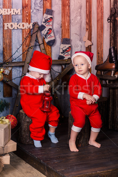 Happy little babys in Santa's costumes near Xmas tree Stock photo © Len44ik