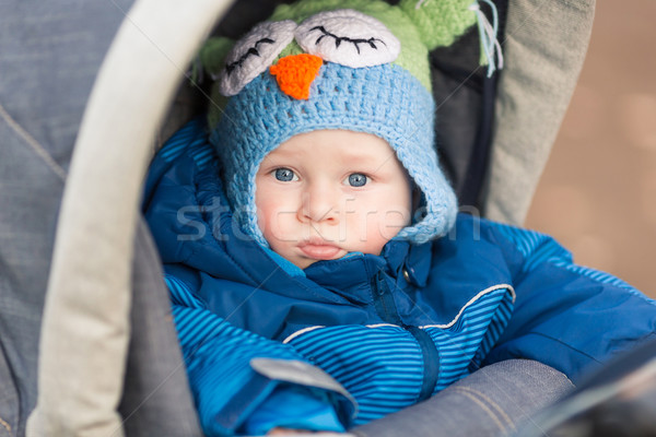 Stock photo: Cute little baby in a stroller