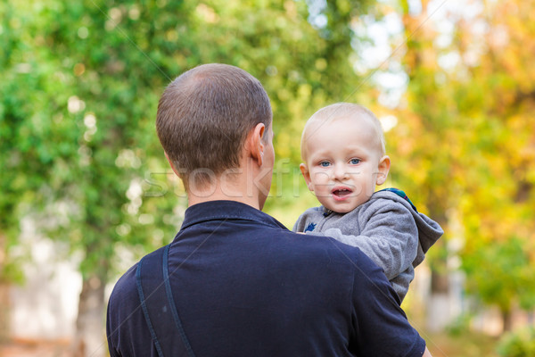 Happy father and his son outdoors. Child hugging daddy. Stock photo © Len44ik