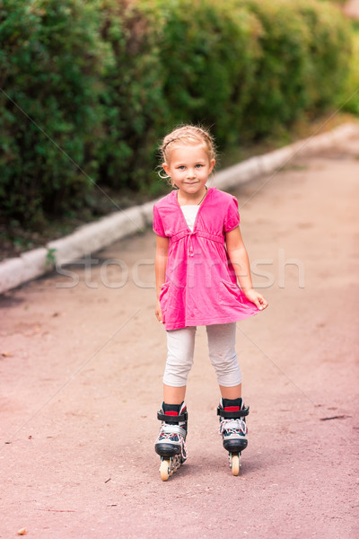 Little girl on roller skates at park Stock photo © Len44ik