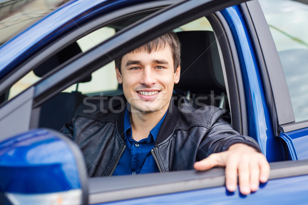 élégant jeune homme séance voiture nouvelle voiture sport [[stock_photo]] © Len44ik