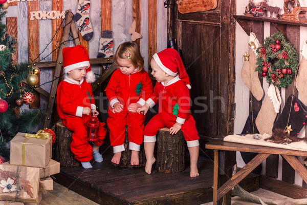 Happy little babys in Santa's costumes near Xmas tree Stock photo © Len44ik