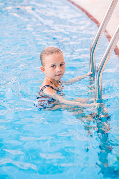 Cute little girl in swimming pool Stock photo © Len44ik