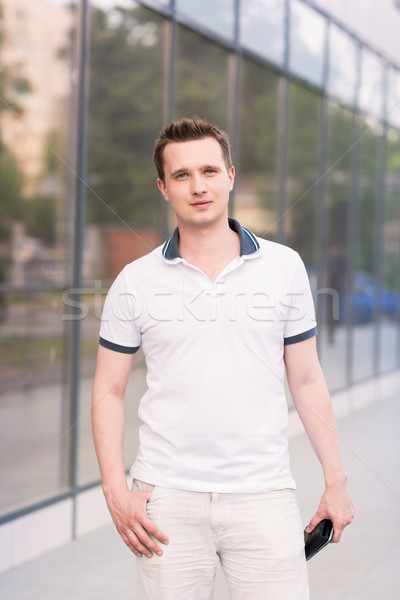 Young handsome man outside the office building Stock photo © Len44ik