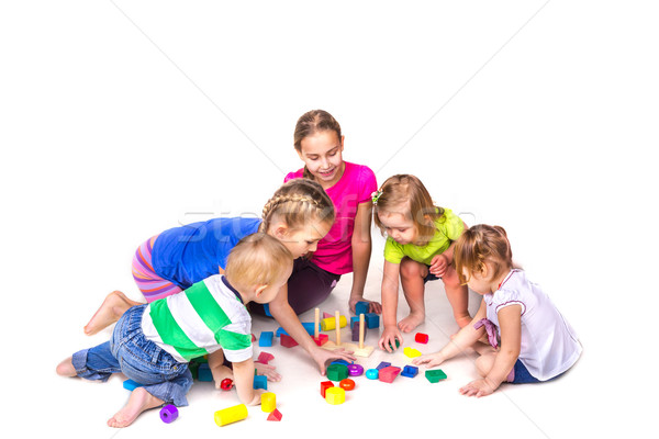 Happy kids playing with building blocks isolated on white Stock photo © Len44ik