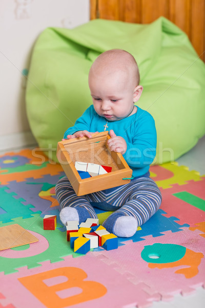 Cute wenig Baby spielen farbenreich Spielzeug Stock foto © Len44ik