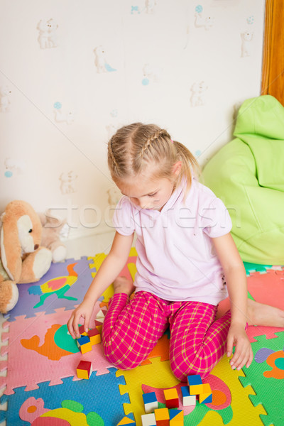 Happy little girl playing with blocks Stock photo © Len44ik