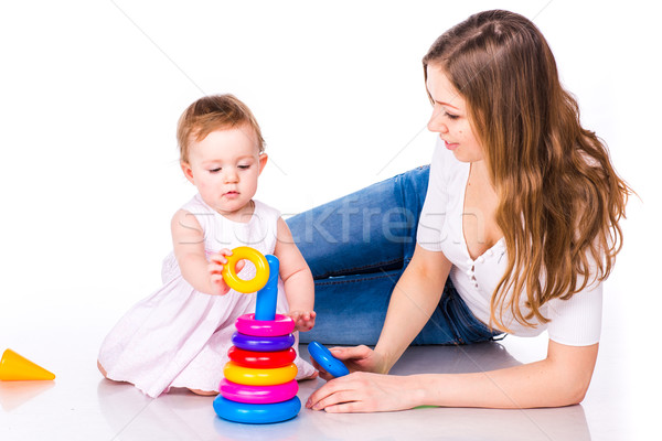 Baby with mother playing with stacking rings Stock photo © Len44ik