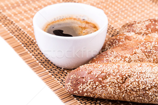 Freshly baked bread rolls with sesame with cup of coffee  Stock photo © Len44ik