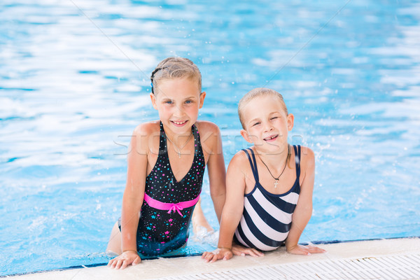 Two cute little girls in swimming pool Stock photo © Len44ik