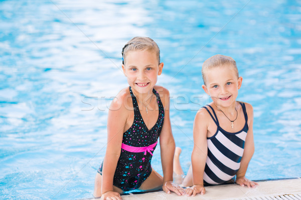 Two cute little girls in swimming pool Stock photo © Len44ik