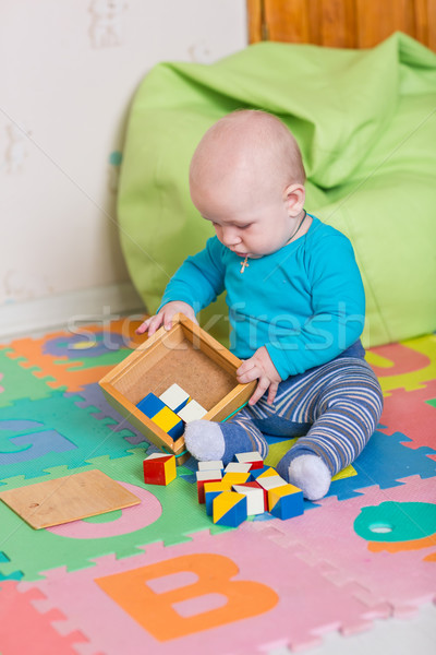 Cute pequeño bebé jugando colorido juguetes Foto stock © Len44ik