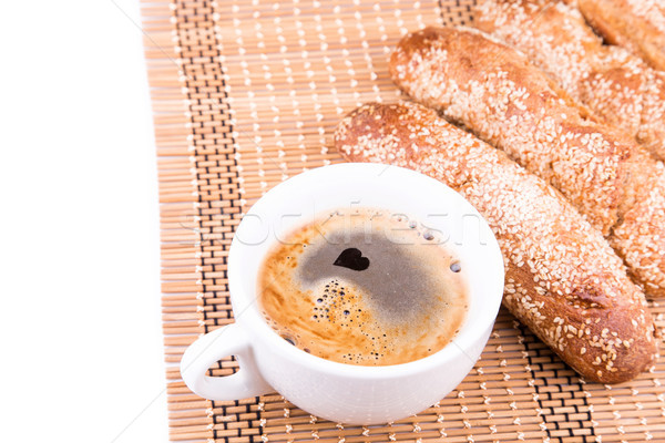 Freshly baked bread rolls with sesame with cup of coffee  Stock photo © Len44ik