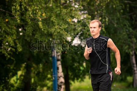 Sportive young man jogging outdoor Stock photo © Len44ik