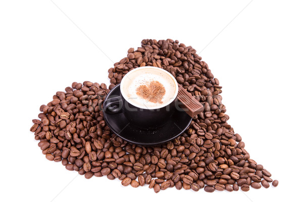 stock photo: cup of coffee with a heart with piece of chocolate.