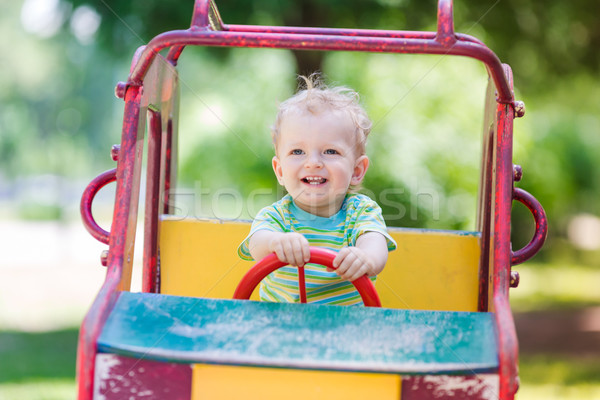 Baby boy driving a toy car at the playground Stock photo © Len44ik