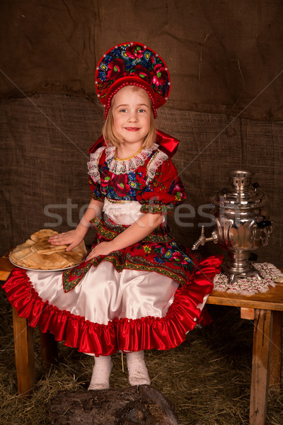 Beautiful russian girl  with full plate of pancakes Stock photo © Len44ik