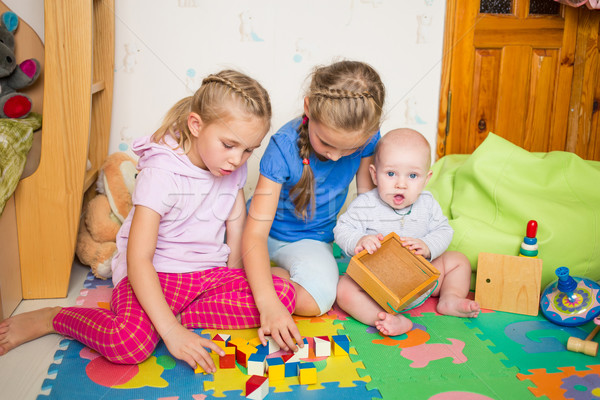 Happy kids playing with little brother Stock photo © Len44ik