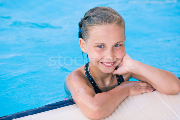 Cute little girl in swimming pool Stock photo © Len44ik