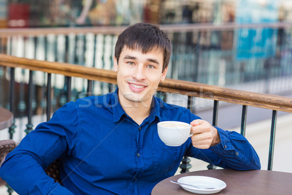 [[stock_photo]]: élégant · jeune · homme · potable · restaurant · pause