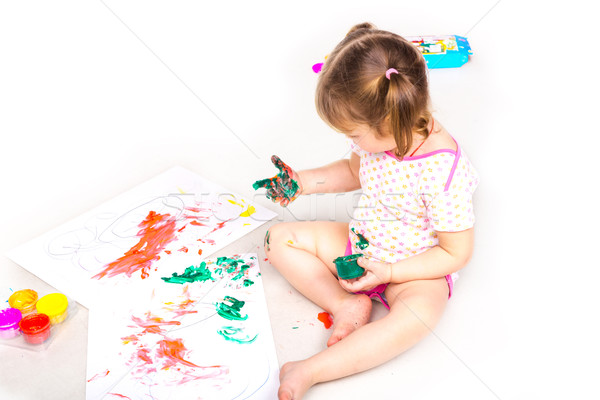Happy baby girl with her hands in paint drawing Stock photo © Len44ik