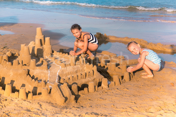 Adorable little girls playing at the seashore Stock photo © Len44ik