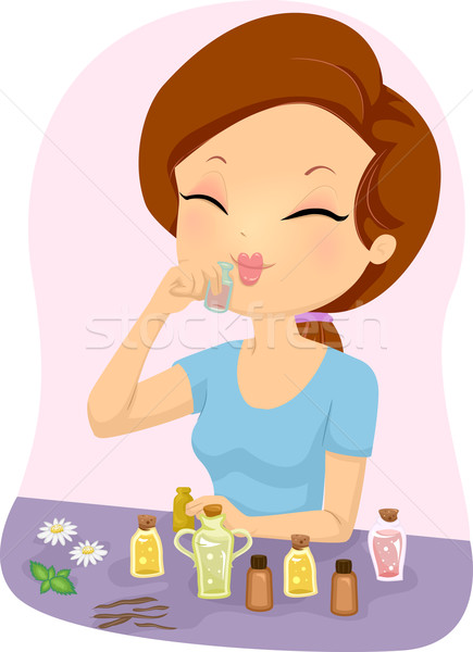 Girl Smelling Essential Oil Stock photo © lenm