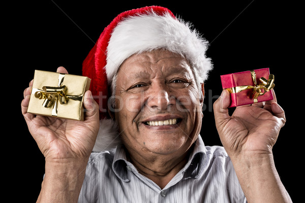 Smiling Aged Man Holding Two Small Xmas Gifts Stock photo © leowolfert