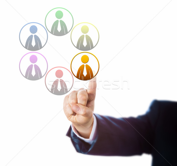 Stock photo: Arm Of Manager Selects On Of Six Diverse Workers