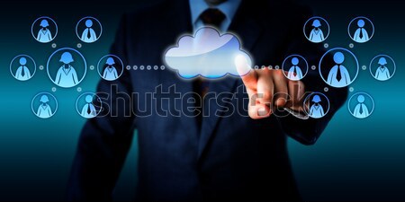 Connecting With Office Workers Via A Blank Cloud Stock photo © leowolfert