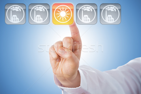 Finger Activating Yellow Solar Energy Icon On Blue Stock photo © leowolfert