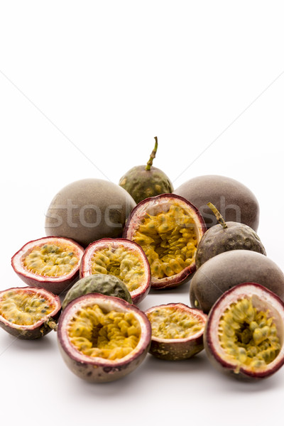 Sour Passion Fruit Pulp In Its Purple Rind Stock photo © leowolfert