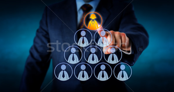 Manager Selecting A Female Worker Atop A Pyramid Stock photo © leowolfert