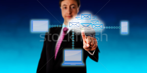 Manager Accessing Email Via A Smart Network Stock photo © leowolfert