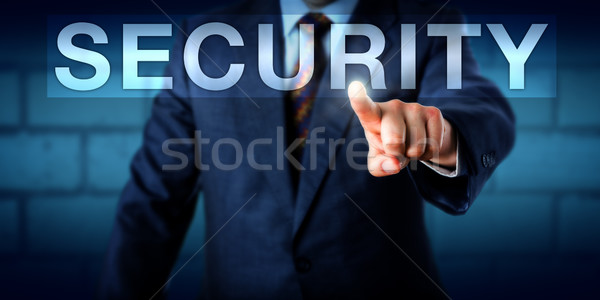 Executive Pressing SECURITY Button Onscreen Stock photo © leowolfert