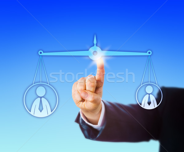 Balancing A Heavy Versus A Light Male Worker Stock photo © leowolfert