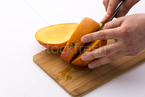 Zweiten geschnitten Mango Ausbeute drei Scheiben Stock foto © leowolfert