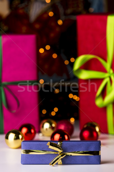Baubles, twinkles and three wrapped gifts
 Stock photo © leowolfert