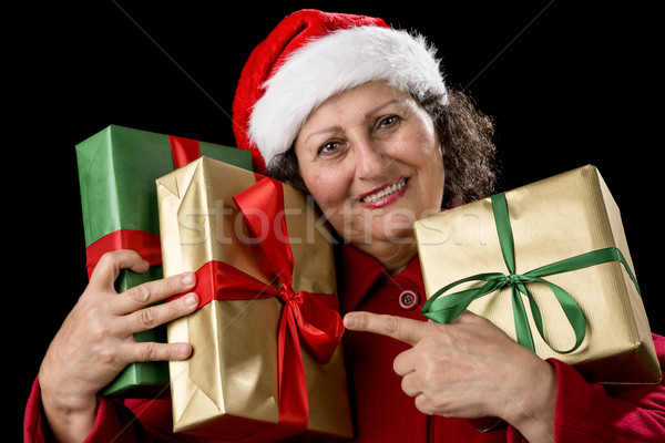 Elderly Woman with Three Wrapped Christmas Gifts
 Stock photo © leowolfert