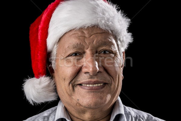 Venerable Man with Red Father Christmas Cap Stock photo © leowolfert