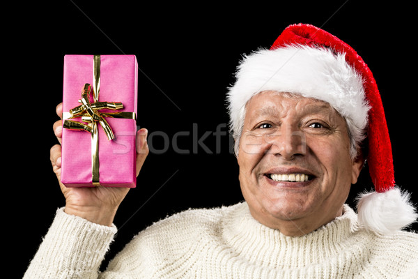 Merry Old Man Showcasing A Pink Wrapped Present Stock photo © leowolfert