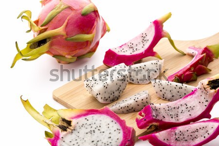 Separating Pitaya Fruit Pulp From Its Skin Stock photo © leowolfert