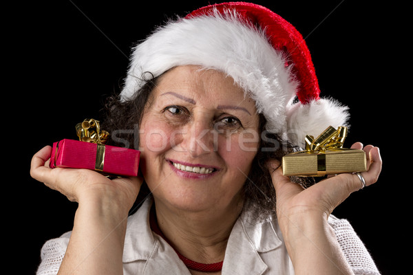 Gentle Aged Woman Holging Two Small Gifts Stock photo © leowolfert