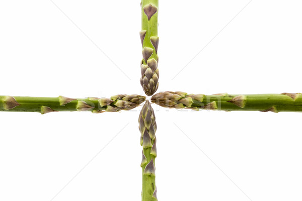 Four Asparagus Spears Meeting in the Middle Stock photo © leowolfert