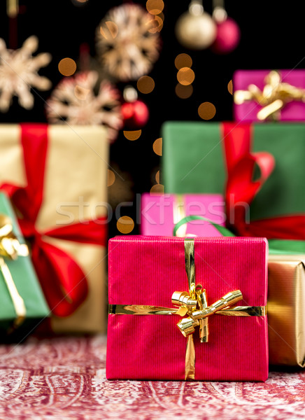 Christmas Background with Gifts and Glitters Stock photo © leowolfert