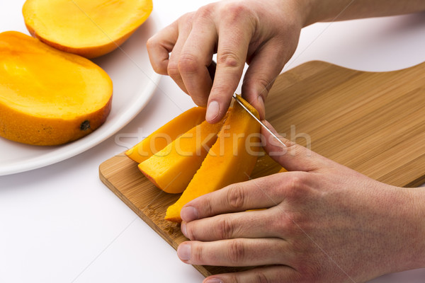 Peeling Away The Mango Skin From A Fruit Chip Stock photo © leowolfert