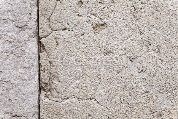 Texture Of Cracks In An Ancient Stone Wall Stock photo © leowolfert