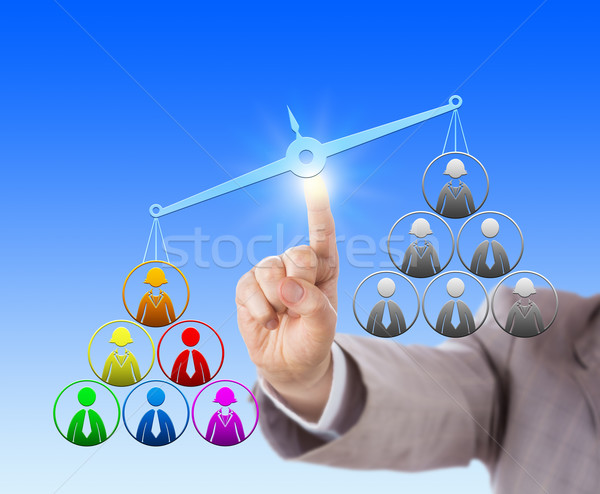 Multicolored Work Team Outweighing Unicolored One Stock photo © leowolfert