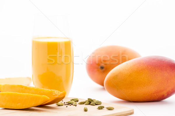 Mangos, Cardamon And Mango Yoghurt Drink On White Stock photo © leowolfert